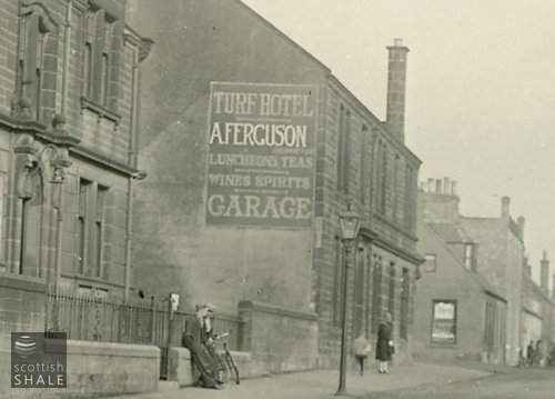 Close up of the sign. Sloping lines on the wall seem to suggest the outline of a gable end of a vanished adjoining building which existed before the Baillie Institute was built? These lines are still apparent today.