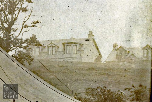 We don&#x27;t know where in central Scotland this photograph was taken – does anyone recognise these fine stone villas perched on the top of the ridge. There are similar (but slightly different) homes in Bo&#x27;ness.